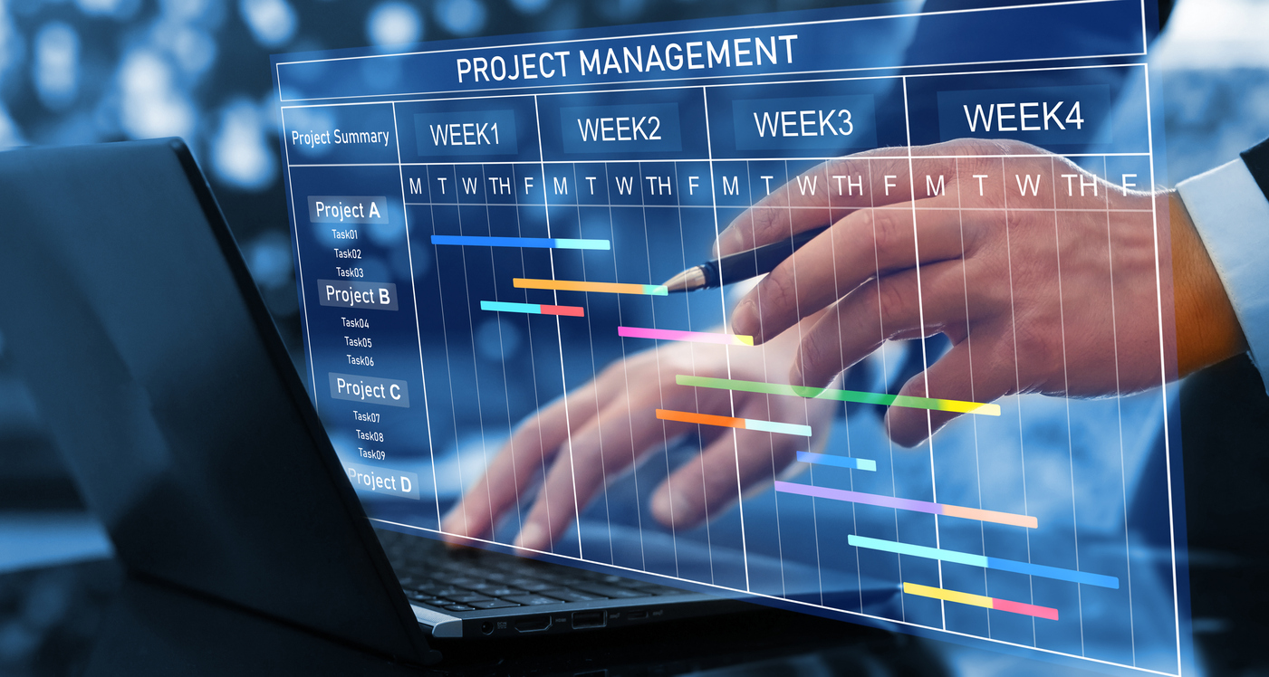 Project manager planning and reviewing a project schedule using a digital project management timeline.