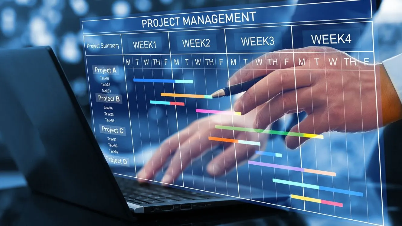 Project manager planning and reviewing a project schedule using a digital project management timeline.